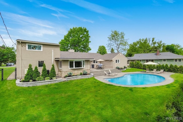 515 Park Club Ln, Amherst, NY 14221 - rear view of property with a patio and a chimney