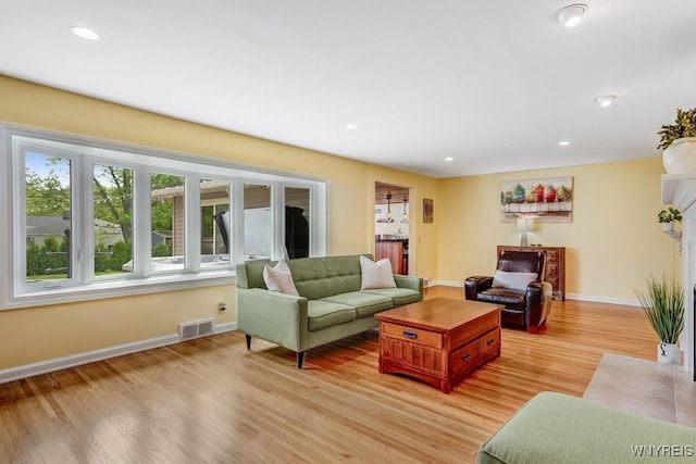 515 Park Club Ln, Amherst, NY 14221 - living room with light wood-type flooring, baseboards, and recessed lighting
