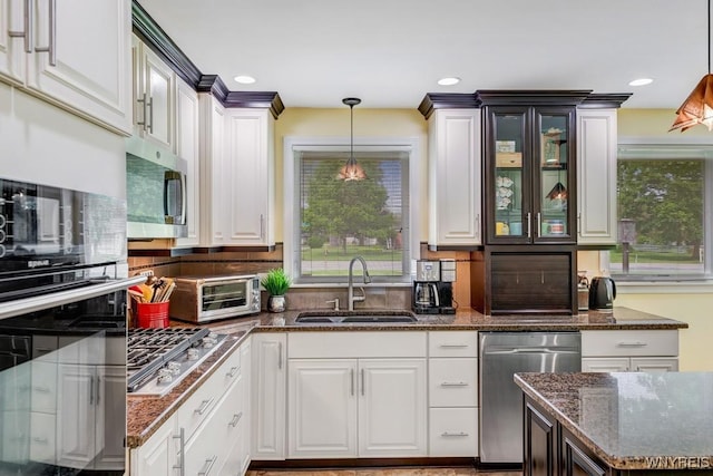 515 Park Club Ln, Amherst, NY 14221 - kitchen featuring a sink, appliances with stainless steel finishes, white cabinets, hanging light fixtures, and recessed lighting