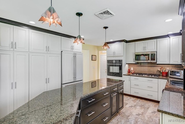 515 Park Club Ln, Amherst, NY 14221 - kitchen with stainless steel appliances, white cabinets, tasteful backsplash, hanging light fixtures, and recessed lighting