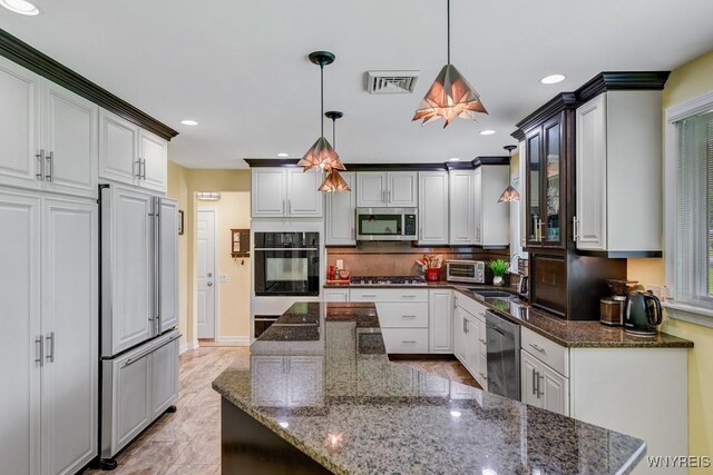 515 Park Club Ln, Amherst, NY 14221 - kitchen featuring stainless steel appliances, recessed lighting, backsplash, a sink, and decorative light fixtures