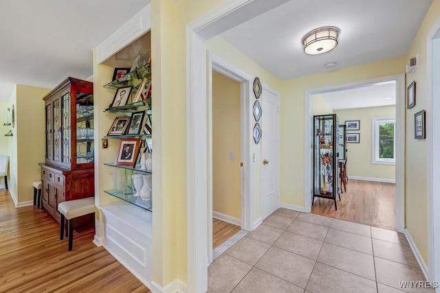 515 Park Club Ln, Amherst, NY 14221 - hallway featuring light wood-type flooring and baseboards