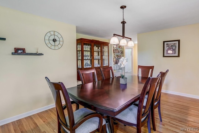 515 Park Club Ln, Amherst, NY 14221 - dining space featuring baseboards and light wood-style flooring