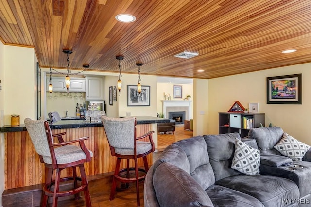 515 Park Club Ln, Amherst, NY 14221 - living area with wooden ceiling, a lit fireplace, bar area, and recessed lighting