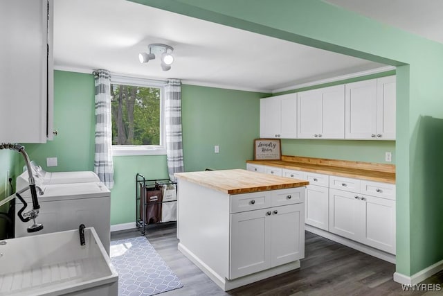 515 Park Club Ln, Amherst, NY 14221 - washroom with washer and dryer, cabinet space, dark wood-style floors, ornamental molding, and baseboards