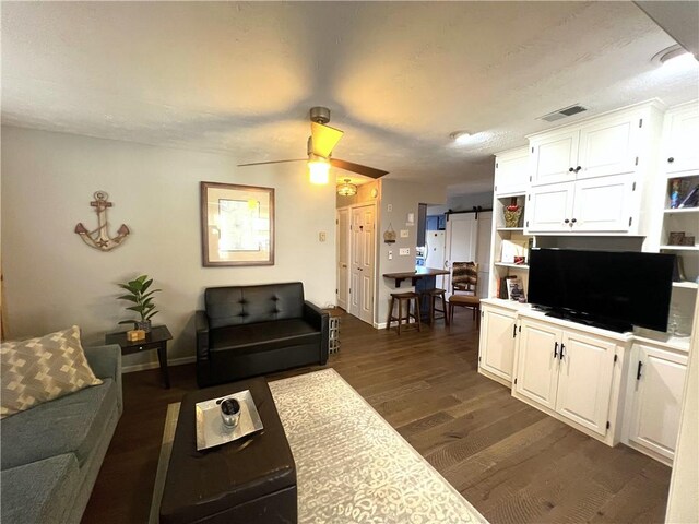 5545 E Lake Rd, Conesus, NY 14435 - living area with dark wood finished floors, baseboards, and a ceiling fan