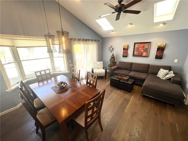 5545 E Lake Rd, Conesus, NY 14435 - dining room featuring a skylight, lofted ceiling, a ceiling fan, hardwood / wood-style floors, and baseboards