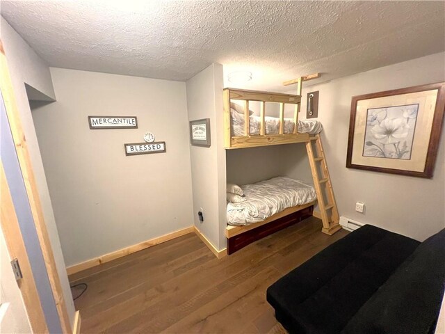 5545 E Lake Rd, Conesus, NY 14435 - bedroom with wood finished floors, baseboards, and a textured ceiling