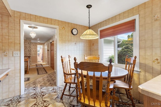 4922 Tenterden Dr, Onondaga, NY 13215 - dining room featuring light tile patterned floors and tile walls