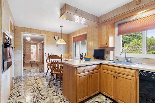 4922 Tenterden Dr, Onondaga, NY 13215 - kitchen featuring black appliances, a sink, a peninsula, and light countertops