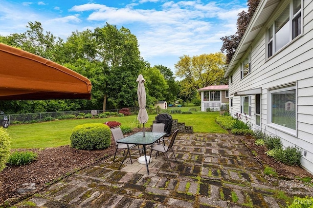 4922 Tenterden Dr, Onondaga, NY 13215 - view of patio with outdoor dining area and view of wooded area