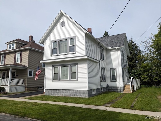 117 N 8th St, Olean-City, NY 14760 - view of home's exterior featuring a chimney, a lawn, covered porch, and roof with shingles