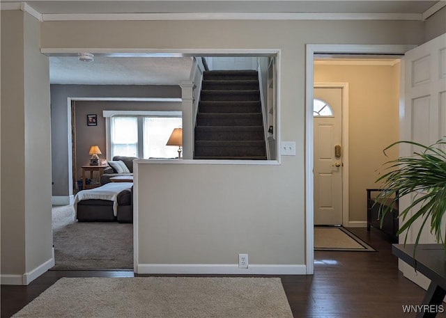 117 N 8th St, Olean-City, NY 14760 - entryway with baseboards, dark wood finished floors, stairs, and ornamental molding