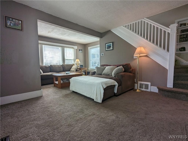 117 N 8th St, Olean-City, NY 14760 - living room with stairway, a textured ceiling, and carpet floors