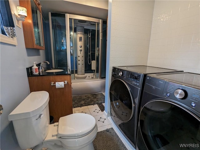 117 N 8th St, Olean-City, NY 14760 - full bath with washing machine and clothes dryer, toilet, vanity, shower / bath combination with glass door, and tile patterned floors