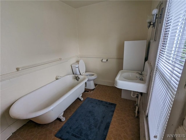 117 N 8th St, Olean-City, NY 14760 - bathroom featuring a freestanding bath, toilet, and a sink