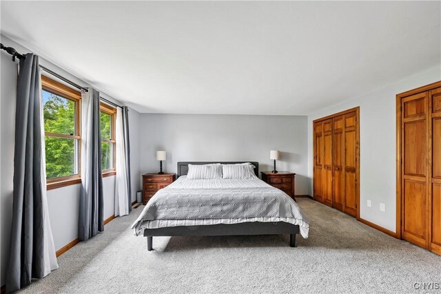 8005 Fir Dr, Clay, NY 13041 - bedroom with light colored carpet and baseboards