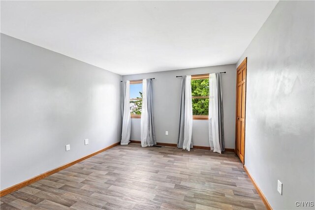 8005 Fir Dr, Clay, NY 13041 - unfurnished room with light wood-style flooring and baseboards