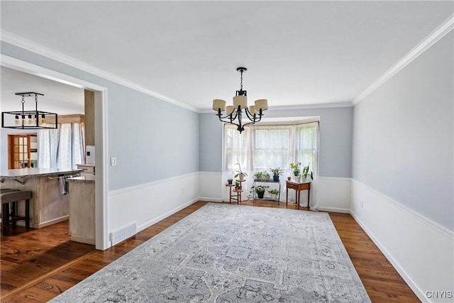 8005 Fir Dr, Clay, NY 13041 - dining space featuring a chandelier, dark wood-style flooring, ornamental molding, and baseboards