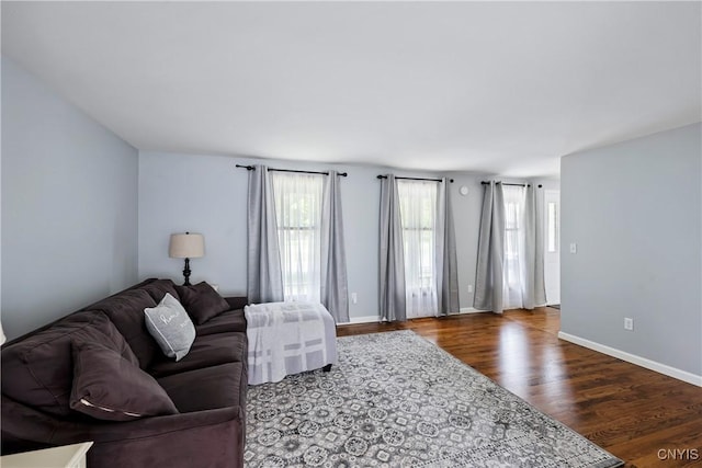 8005 Fir Dr, Clay, NY 13041 - living room featuring dark wood-type flooring and baseboards