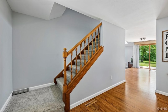 8005 Fir Dr, Clay, NY 13041 - staircase featuring baseboards and wood finished floors