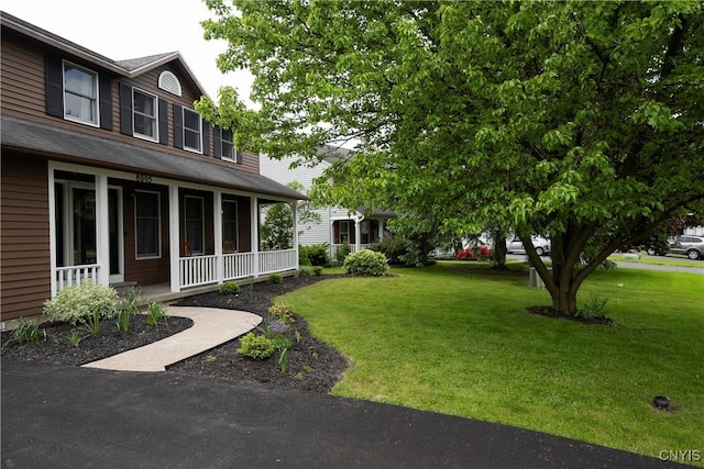 8005 Fir Dr, Clay, NY 13041 - view of green lawn featuring covered porch