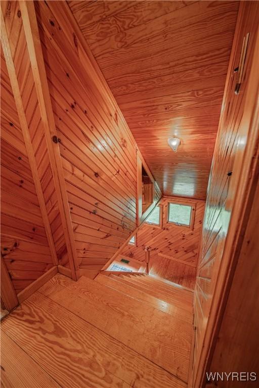 3557 Hartland Rd, Hartland, NY 14067 - stairway featuring wooden ceiling and wood walls