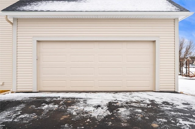 30 Legends Way, Greece, NY 14612 - snow covered garage with driveway