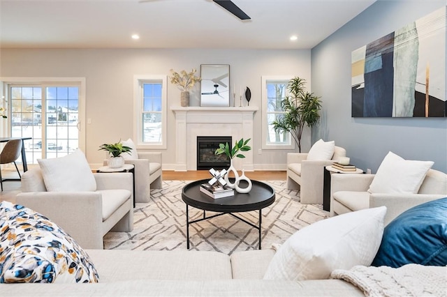 30 Legends Way, Greece, NY 14612 - living room with ceiling fan, plenty of natural light, recessed lighting, a glass covered fireplace, and wood finished floors