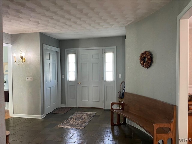 624 Deerfield Dr, Oneida-Inside, NY 13421 - entryway featuring baseboards and stone tile floors