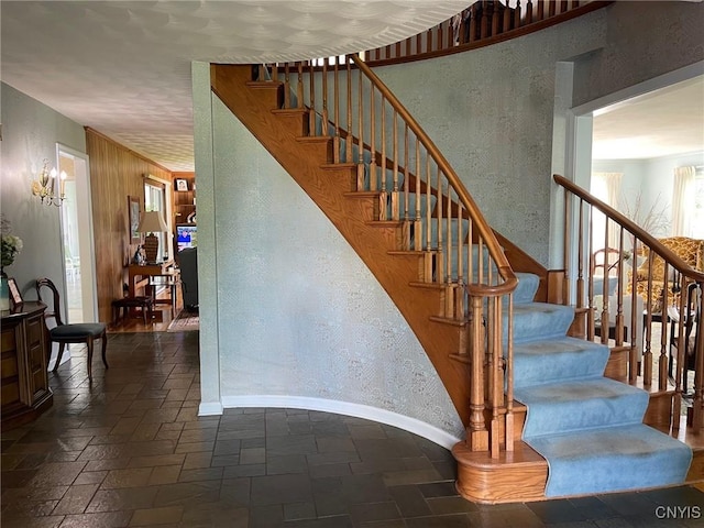 624 Deerfield Dr, Oneida-Inside, NY 13421 - stairway featuring a textured wall, stone tile flooring, and baseboards