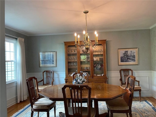 624 Deerfield Dr, Oneida-Inside, NY 13421 - dining room featuring a chandelier, wood finished floors, wainscoting, and ornamental molding