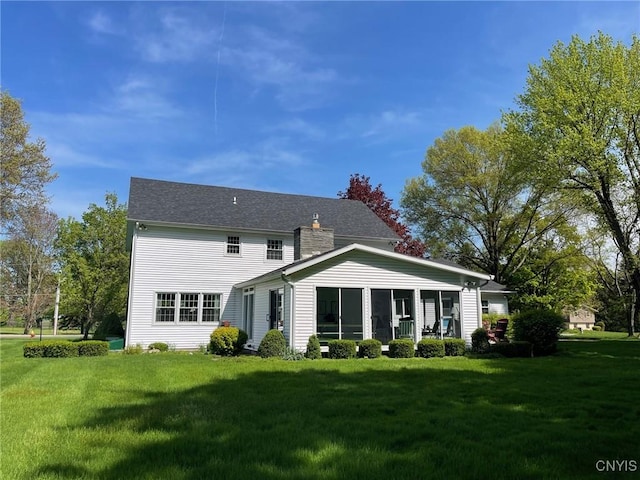 624 Deerfield Dr, Oneida-Inside, NY 13421 - rear view of property with a chimney, a yard, and a sunroom