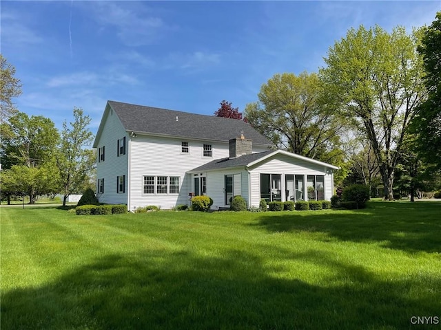 624 Deerfield Dr, Oneida-Inside, NY 13421 - rear view of property featuring a lawn, a chimney, and a shingled roof