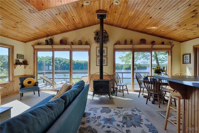 Hanson Bridge Road, Theresa, NY 13691 - living area with a wood stove, lofted ceiling, carpet flooring, a water view, and wooden ceiling