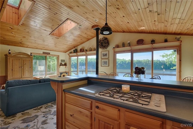 Hanson Bridge Road, Theresa, NY 13691 - kitchen featuring a skylight, dark countertops, vaulted ceiling, white gas stovetop, and wood ceiling