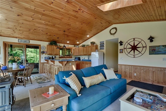 Hanson Bridge Road, Theresa, NY 13691 - living room featuring carpet flooring, wooden ceiling, a skylight, a wainscoted wall, and vaulted ceiling