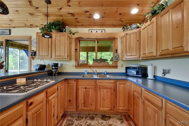 Hanson Bridge Road, Theresa, NY 13691 - kitchen featuring black microwave, white gas cooktop, healthy amount of natural light, dark countertops, and recessed lighting
