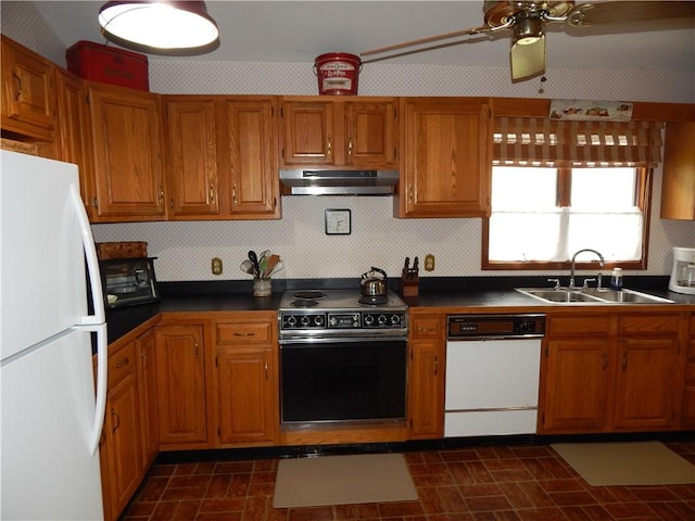 6731 Lake Salubria Dr, Bath, NY 14810 - kitchen with white appliances, under cabinet range hood, a sink, and brown cabinetry