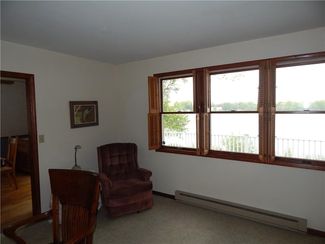 6731 Lake Salubria Dr, Bath, NY 14810 - living area with a baseboard radiator, baseboards, a water view, and carpet floors