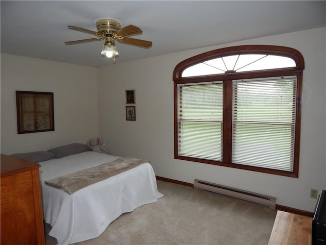 6731 Lake Salubria Dr, Bath, NY 14810 - bedroom with a baseboard heating unit, baseboards, and a ceiling fan