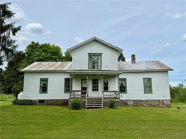 4151 State Route 20, Nelson, NY 13408 - rear view of house with covered porch, a lawn, and metal roof