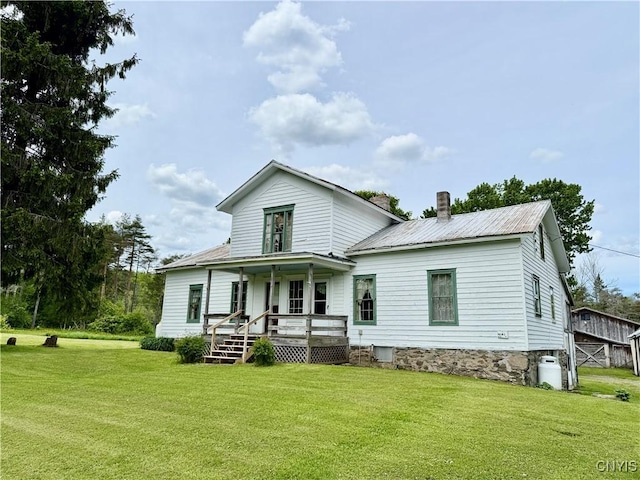 4151 State Route 20, Nelson, NY 13408 - rear view of property featuring covered porch, a yard, and metal roof