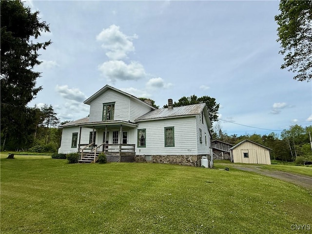 4151 State Route 20, Nelson, NY 13408 - view of front of house with covered porch, dirt driveway, a front lawn, metal roof, and a chimney