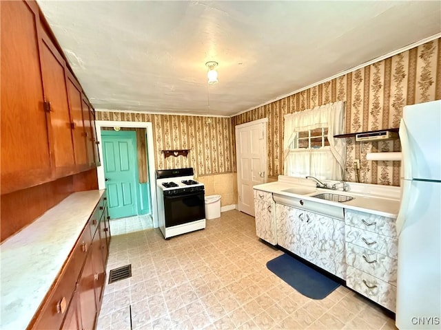 4151 State Route 20, Nelson, NY 13408 - kitchen featuring range with gas cooktop, freestanding refrigerator, light floors, a sink, and light countertops