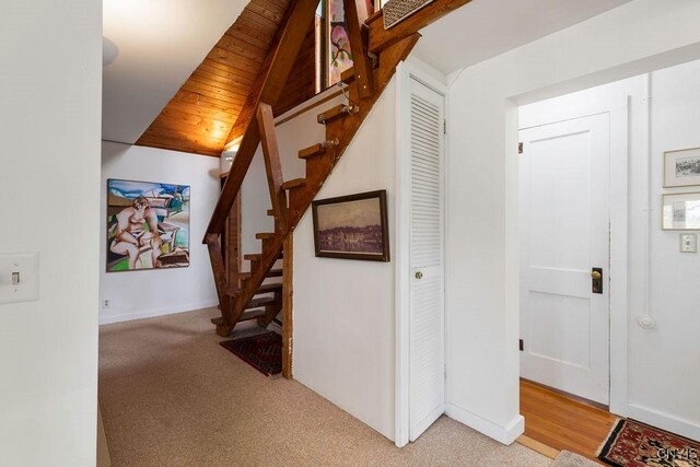 3435 E Lake Rd, Skaneateles, NY 13152 - corridor featuring stairs, wooden ceiling, light colored carpet, and baseboards