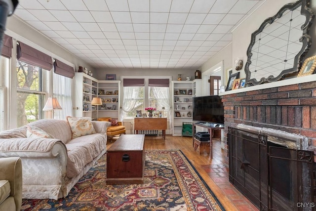 3435 E Lake Rd, Skaneateles, NY 13152 - living area featuring a brick fireplace and wood finished floors