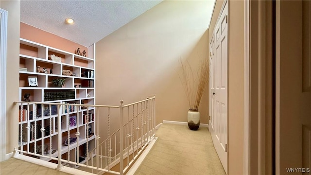 3134 E River Rd, Grand Island, NY 14072 - corridor with an upstairs landing, light colored carpet, a textured ceiling, and baseboards