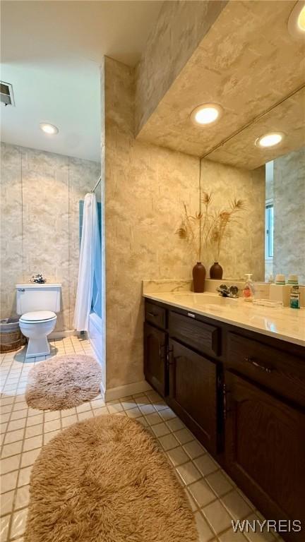 3134 E River Rd, Grand Island, NY 14072 - bathroom with vanity, toilet, tile patterned floors, recessed lighting, and shower / tub combo with curtain