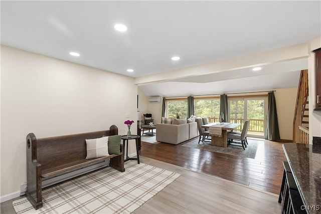 147 Crooked Lake Rd, Tully, NY 13159 - living room with a wall unit AC, plenty of natural light, light wood finished floors, stairs, and recessed lighting